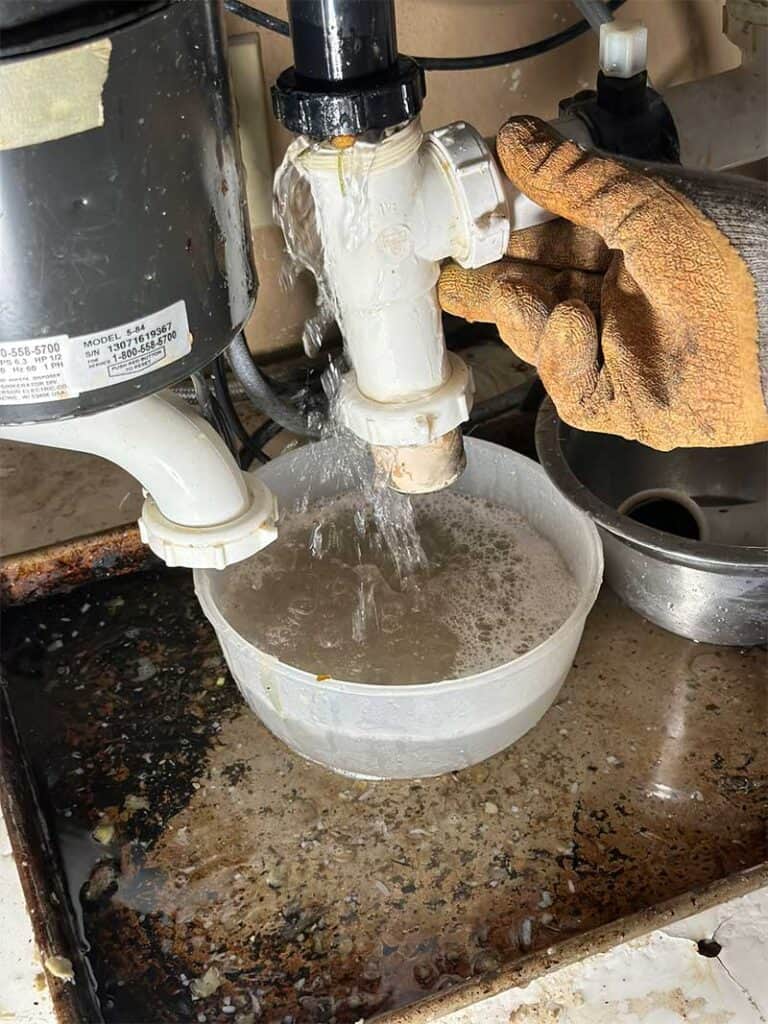 How to Fix a Kitchen Sink Clogged Past the Trap (Save Plumber Fees
